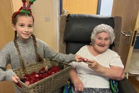Trixie Forrest (nine) handed out Christmas gifts to residents at Woodside Home for the Elderly in Padiham