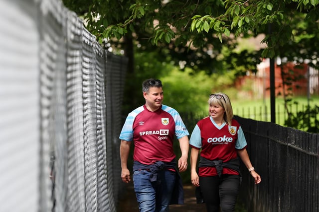 BURNLEY, ENGLAND - MAY 22: Burnley fans arrive at the stadium prior to the Premier League match between Burnley and Newcastle United at Turf Moor on May 22, 2022 in Burnley, England. (Photo by Jan Kruger/Getty Images)
