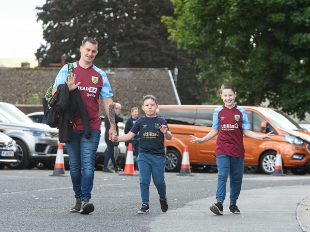 Burnley fans arrive at Turf Moor ahead of the Lancashire Derby with Blackpool. Photo: Kelvin Stuttard