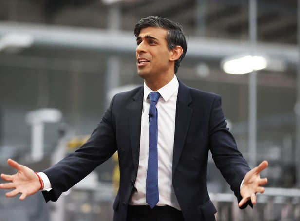 <p>Rishi Sunak talks to local business leaders during a visit to a Coca-Cola factory in Lisburn, Northern Ireland yesterday (Picture: Liam McBurney/WPA pool/Getty Images)</p>