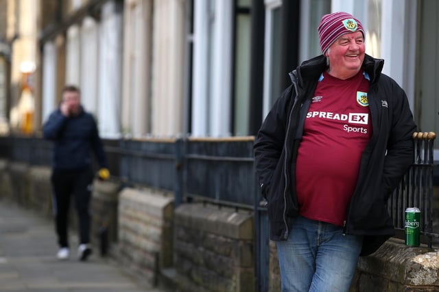 BURNLEY, ENGLAND - APRIL 02: A Burnley fan looks on outside the stadium prior to the Premier League match between Burnley and Manchester City at Turf Moor on April 02, 2022 in Burnley, England. (Photo by Alex Livesey/Getty Images)