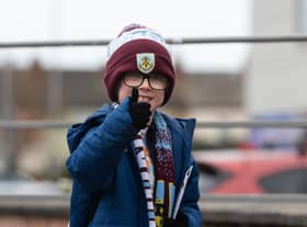 Burnley fans arrive at Bloomfield Road ahead of the Championship fixture against Blackpool. Photo: Kelvin Stuttard