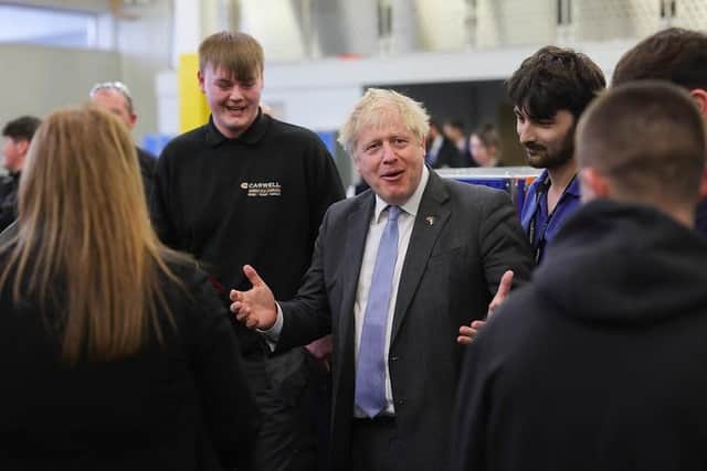 Boris Johnson, who survived last night's no confidence vote, during his visit to Burnley College last month