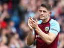 BURNLEY, ENGLAND - MAY 22: James Tarkowski of Burnley applauds the fans following defeat and relegation to the Sky Bet Championship following the Premier League match between Burnley and Newcastle United at Turf Moor on May 22, 2022 in Burnley, England. (Photo by Jan Kruger/Getty Images)