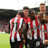 BRENTFORD, ENGLAND - OCTOBER 21: Yoane Wissa of Brentford celebrates with teammates after scoring the team's first goal during the Premier League match between Brentford FC and Burnley FC at Gtech Community Stadium on October 21, 2023 in Brentford, England. (Photo by Luke Walker/Getty Images)