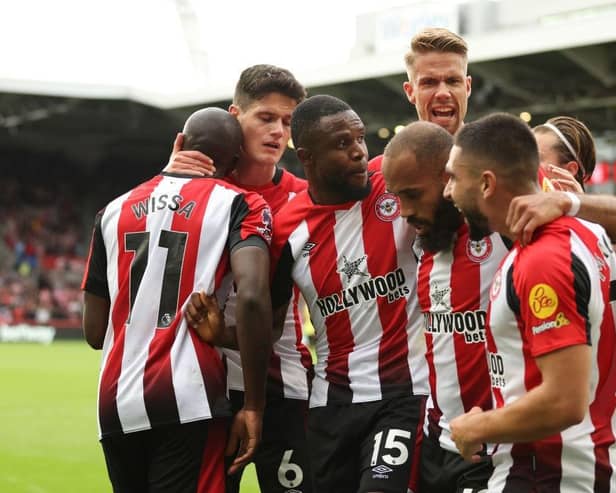 BRENTFORD, ENGLAND - OCTOBER 21: Yoane Wissa of Brentford celebrates with teammates after scoring the team's first goal during the Premier League match between Brentford FC and Burnley FC at Gtech Community Stadium on October 21, 2023 in Brentford, England. (Photo by Luke Walker/Getty Images)