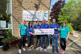 The Pendleside Hospice team with their donations cheque from the Bunny Hop 2023.