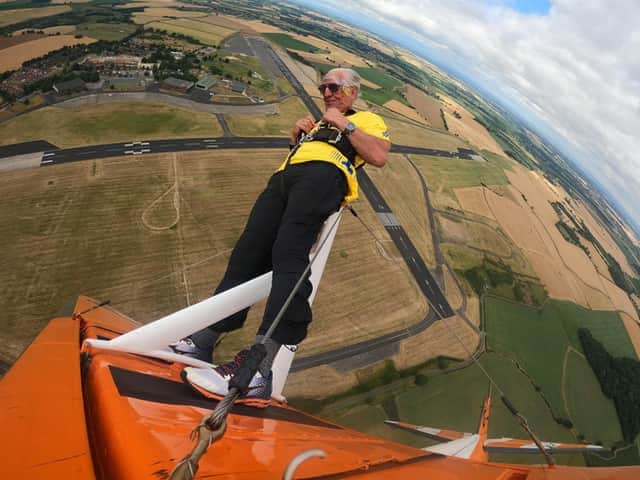 Daring Ivor Emo ticked doing a wing walk off his 'bucket list' at the age of 73 and raised £1,200 for charity at the same time