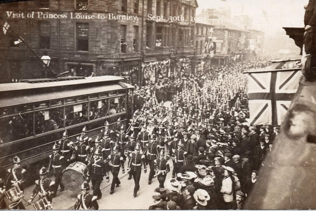 Princess Louise, the daughter of Queen Victoria, came to Burnley in 1905 to open accommodation for injured soldiers in Salus Street, near the Victoria Hospital. This photograph shows the crowds that came to see her. A large military band is marching up Manchester Road, the town centre in the distance. A single-decker tram, full of passengers, can be seen on the right.