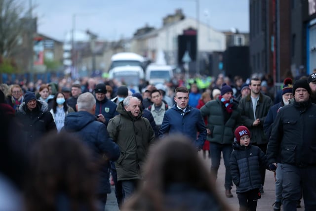 BURNLEY, ENGLAND - APRIL 06: Fans make their way towards the stadium prior to the Premier League match between Burnley and Everton at Turf Moor on April 06, 2022 in Burnley, England. (Photo by Jan Kruger/Getty Images)