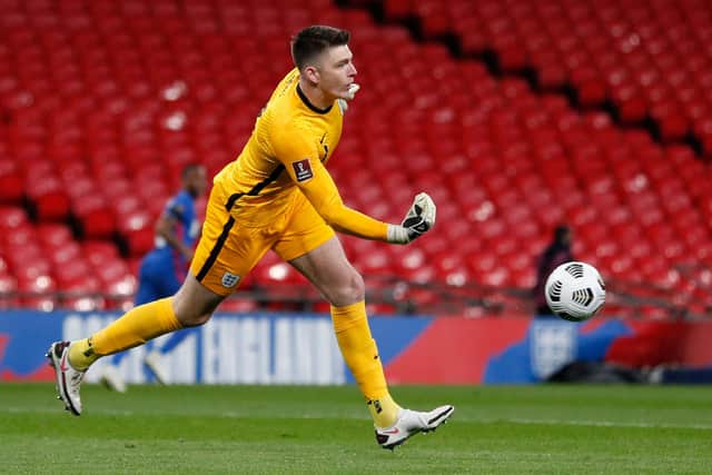 England's goalkeeper Nick Pope rolls the ball out during the FIFA World Cup Qatar 2022 qualification football match between England and San Marino at Wembley Stadium in London on March 25, 2021. - - NOT FOR MARKETING OR ADVERTISING USE / RESTRICTED TO EDITORIAL USE (Photo by Adrian DENNIS / POOL / AFP) / NOT FOR MARKETING OR ADVERTISING USE / RESTRICTED TO EDITORIAL USE (Photo by ADRIAN DENNIS/POOL/AFP via Getty Images)