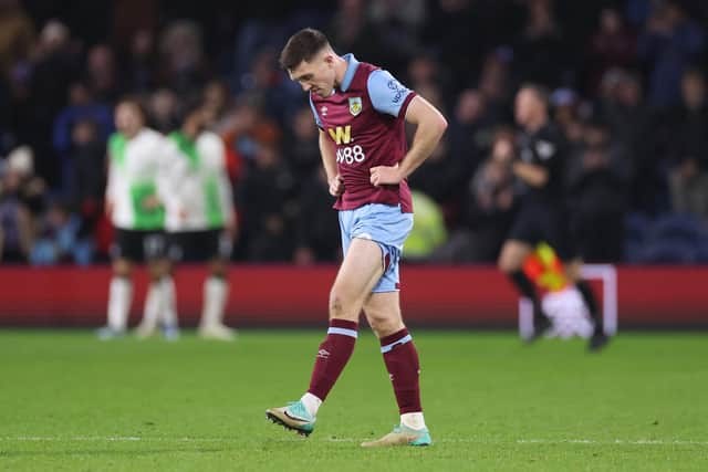 BURNLEY, ENGLAND - DECEMBER 26: Dara O'Shea of Burnley looks dejected after the team's defeat in the Premier League match between Burnley FC and Liverpool FC at Turf Moor on December 26, 2023 in Burnley, England. (Photo by Lewis Storey/Getty Images)