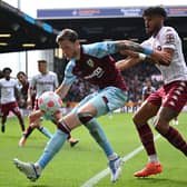 Burnley's Dutch striker Wout Weghorst (L) vies with Aston Villa's English defender Tyrone Mings (R) during the English Premier League football match between Burnley and Aston Villa at Turf Moor in Burnley, north west England on May 7, 2022.