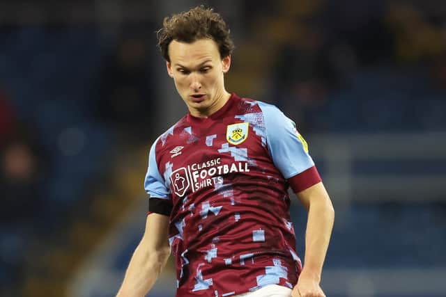 BURNLEY, ENGLAND - FEBRUARY 14: Hjalmar Ekdal of Burnley passes the ball during the Sky Bet Championship between Burnley and Watford at Turf Moor on February 14, 2023 in Burnley, England. (Photo by Clive Brunskill/Getty Images)