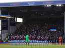 BURNLEY, ENGLAND - MARCH 05: Players, officials and fans take part in a minute of applause to indicate peace and sympathy with Ukraine prior to the Premier League match between Burnley and Chelsea at Turf Moor on March 05, 2022 in Burnley, England.