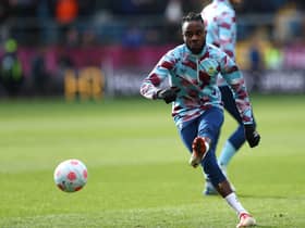 BURNLEY, ENGLAND - MARCH 05: Maxwel Cornet of Burnley warms up prior to the Premier League match between Burnley and Chelsea at Turf Moor on March 05, 2022 in Burnley, England. (Photo by Alex Livesey/Getty Images)