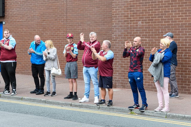 Crowds gather on Harry Potts Way outside Turf Moor to pay their respects to Derek 'Rocky' Mills. Photo: Kelvin Stuttard