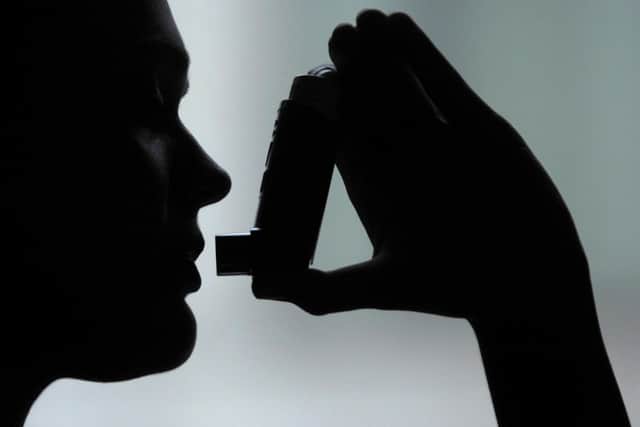 PICTURE POSED BY MODEL.
Photo of a person using an inhaler to take salbutamol to treat asthma. PRESS ASSOCIATION Photo. Photo credit: Clive Gee/PA Wire