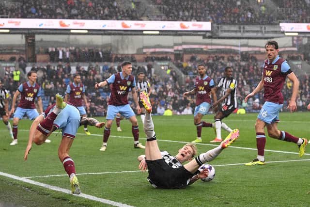 BURNLEY, ENGLAND - MAY 04: Anthony Gordon of Newcastle United reacts after being fouled by Josh Brownhill for a penalty during the Premier League match between Burnley FC and Newcastle United at Turf Moor on May 04, 2024 in Burnley, England. (Photo by Stu Forster/Getty Images)
