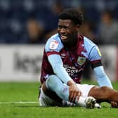PRESTON, ENGLAND - SEPTEMBER 13: Nathan Tella of Burnley reacts after picking up an injury during the Sky Bet Championship between Preston North End and Burnley at Deepdale on September 13, 2022 in Preston, England. (Photo by Lewis Storey/Getty Images)