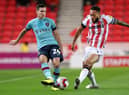 STOKE ON TRENT, ENGLAND - DECEMBER 30: Josh Cullen of Burnley is challenged by Lewis Baker of Stoke City during the Sky Bet Championship match between Stoke City and Burnley at Bet365 Stadium on December 30, 2022 in Stoke on Trent, England. (Photo by Charlotte Tattersall/Getty Images)