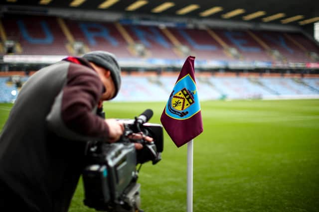 A television cameraman films prior to the Premier League match between Burnley FC and Wolverhampton Wanderers at Turf Moor on March 30, 2019 in Burnley, United Kingdom.