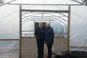 Ida Carmichael (right ) in one of the polytunnels with Billie Jean Horne, the community champion for Tesco, Burnley