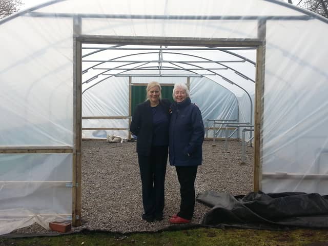 Ida Carmichael (right ) in one of the polytunnels with Billie Jean Horne, the community champion for Tesco, Burnley