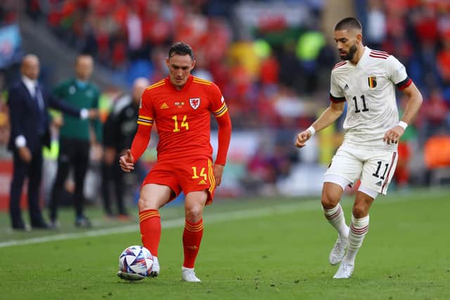 CARDIFF, WALES - JUNE 11: Connor Roberts of Wales is challenged by Yannick Carrasco of Belgium during the UEFA Nations League League A Group 4 match between Wales and Belgium at Cardiff City Stadium on June 11, 2022 in Cardiff, Wales. (Photo by Michael Steele/Getty Images)