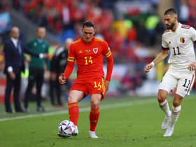 CARDIFF, WALES - JUNE 11: Connor Roberts of Wales is challenged by Yannick Carrasco of Belgium during the UEFA Nations League League A Group 4 match between Wales and Belgium at Cardiff City Stadium on June 11, 2022 in Cardiff, Wales. (Photo by Michael Steele/Getty Images)