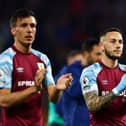 BURNLEY, ENGLAND - APRIL 21: Jack Cork and Josh Brownhill of Burnley applaud the fans after victory in the Premier League match between Burnley and Southampton at Turf Moor on April 21, 2022 in Burnley, England. (Photo by Clive Brunskill/Getty Images)