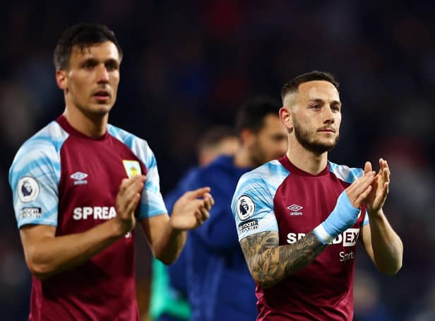 BURNLEY, ENGLAND - APRIL 21: Jack Cork and Josh Brownhill of Burnley applaud the fans after victory in the Premier League match between Burnley and Southampton at Turf Moor on April 21, 2022 in Burnley, England. (Photo by Clive Brunskill/Getty Images)