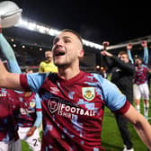 BLACKBURN, ENGLAND - APRIL 25: Taylor Harwood-Bellis of Burnley celebrates towards the fans after winning the Sky Bet Championship following victory against the Blackburn Rovers and Burnley at Ewood Park on April 25, 2023 in Blackburn, England. (Photo by Matt McNulty/Getty Images)