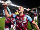 BLACKBURN, ENGLAND - APRIL 25: Taylor Harwood-Bellis of Burnley celebrates towards the fans after winning the Sky Bet Championship following victory against the Blackburn Rovers and Burnley at Ewood Park on April 25, 2023 in Blackburn, England. (Photo by Matt McNulty/Getty Images)