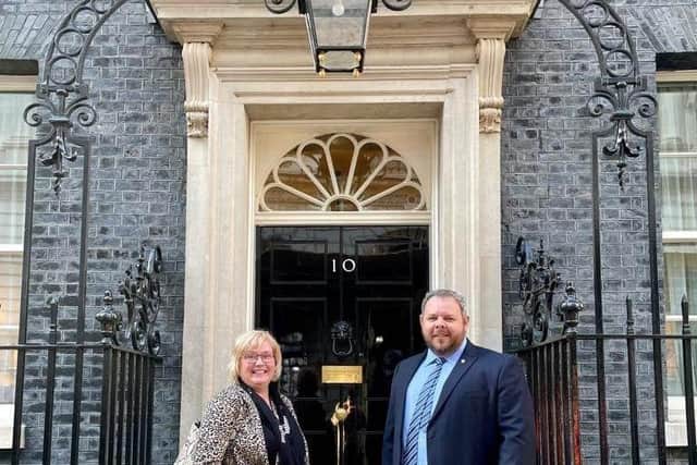 Reporter Sue Plunkett on the steps od Number 10 Downing Street with Burnley MP Antony Higginbotham