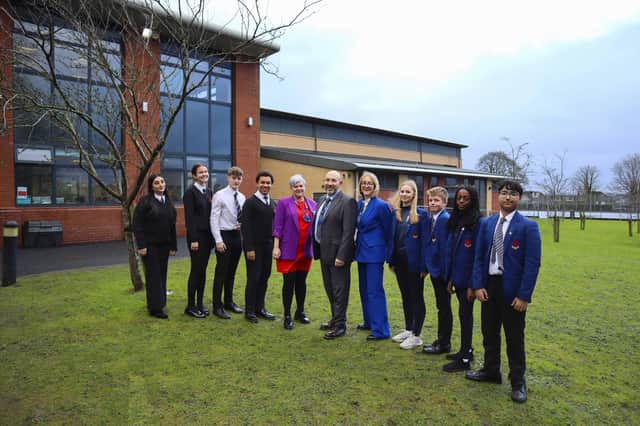 Pupils at Clitheroe Royal Grammar School with staff members (from left to right): Mrs K. L. Johnston, Deputy Headteacher and Head of Sixth Form; Mr J. M. Keulemans, Headteacher; and Miss J. Renold, Deputy Headteacher and Head of Main School.