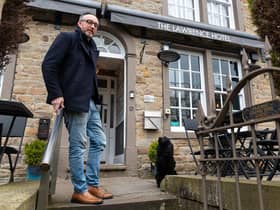 Michael Huckerby, owner of The Lawrence Hotel in Padiham with his dog Hetty. Photo: Kelvin Stuttard