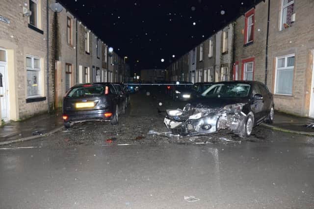 Cars damaged following a shooting in Burnley involving an OCG