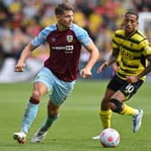 Watford's Brazilian striker Joao Pedro (R) vies with Burnley's English defender James Tarkowski (L) during the English Premier League football match between Watford and Burnley at Vicarage Road Stadium in Watford, north-west of London, on April 30, 2022.