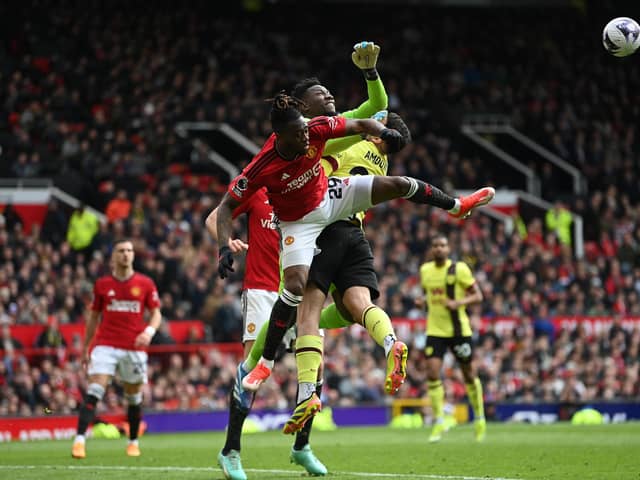 MANCHESTER, ENGLAND - APRIL 27: Manchester United goalkeeper André Onana fouls Zeki Amdouni of Burnley to concede a penalty kick during the Premier League match between Manchester United and Burnley FC at Old Trafford on April 27, 2024 in Manchester, England. (Photo by Gareth Copley/Getty Images) (Photo by Gareth Copley/Getty Images)