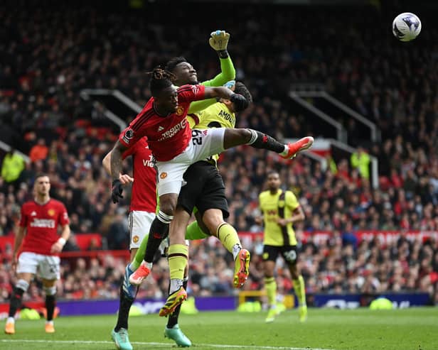 MANCHESTER, ENGLAND - APRIL 27: Manchester United goalkeeper André Onana fouls Zeki Amdouni of Burnley to concede a penalty kick during the Premier League match between Manchester United and Burnley FC at Old Trafford on April 27, 2024 in Manchester, England. (Photo by Gareth Copley/Getty Images) (Photo by Gareth Copley/Getty Images)
