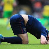 NORWICH, ENGLAND - APRIL 10: Charlie Taylor of Burnley reacts during the Premier League match between Norwich City and Burnley at Carrow Road on April 10, 2022 in Norwich, England. (Photo by Stephen Pond/Getty Images)