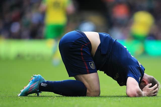 NORWICH, ENGLAND - APRIL 10: Charlie Taylor of Burnley reacts during the Premier League match between Norwich City and Burnley at Carrow Road on April 10, 2022 in Norwich, England. (Photo by Stephen Pond/Getty Images)