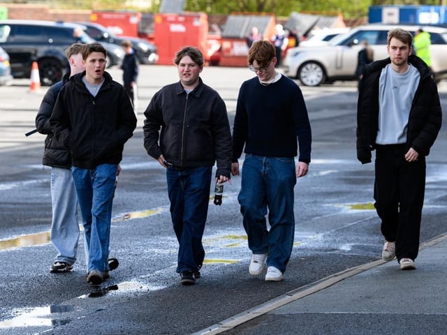 Burnley fans arrive at Turf Moor for the Premier League fixture against Brighton and Hove Albion. Photo: Kelvin Lister-Stuttard