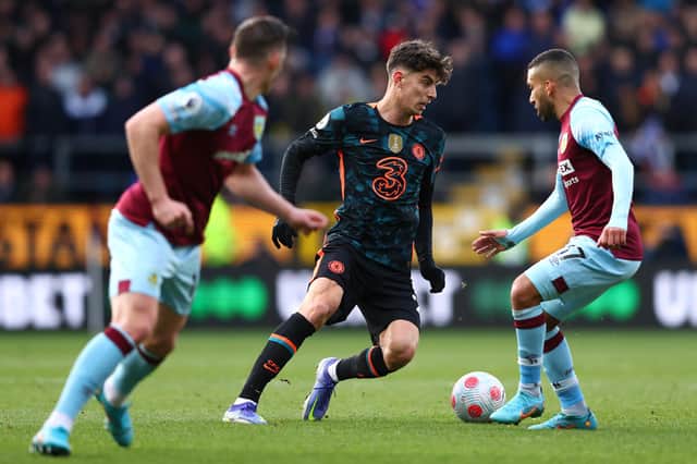 BURNLEY, ENGLAND - MARCH 05:  Kai Havertz of Chelsea takes on Aaron Lennon of Burnley during the Premier League match between Burnley and Chelsea at Turf Moor on March 05, 2022 in Burnley, England.