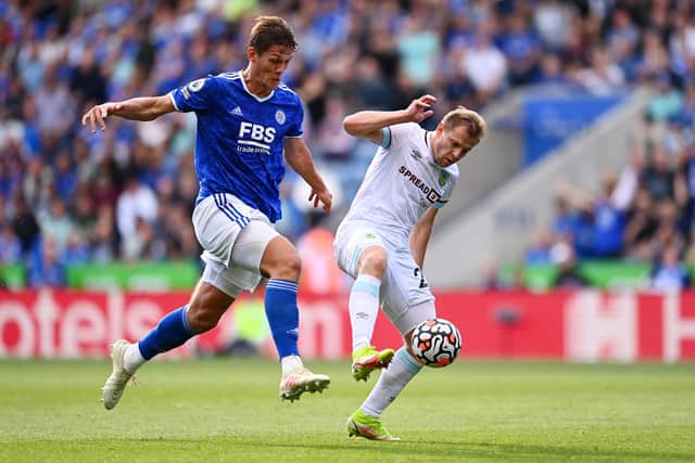 LEICESTER, ENGLAND - SEPTEMBER 25: Luke Thomas of Leicester City battles for possession with Matej Vydra of Burnley  during the Premier League match between Leicester City and Burnley at The King Power Stadium on September 25, 2021 in Leicester, England. (Photo by Clive Mason/Getty Images)