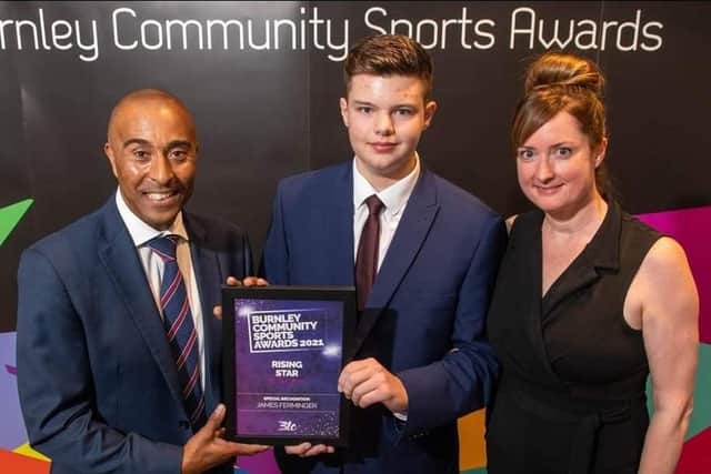 Spartans Goal Shooter James Firminger (centre) is pictured with mum, Bernardine, while receiving his 'Rising Star' prize from Colin Jackson at the Burnley Community Sports Awards.