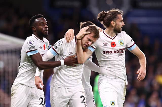 LONDON, ENGLAND - NOVEMBER 06: Matej Vydra celebrates with teammates Maxwel Cornet and Jay Rodriguez of Burnley after scoring their team's first goal during the Premier League match between Chelsea and Burnley at Stamford Bridge on November 06, 2021 in London, England. (Photo by Ryan Pierse/Getty Images)