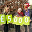 Joan Sagar win £5,000 in Derian House's Christmas raffle
