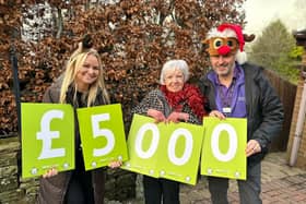 Joan Sagar win £5,000 in Derian House's Christmas raffle